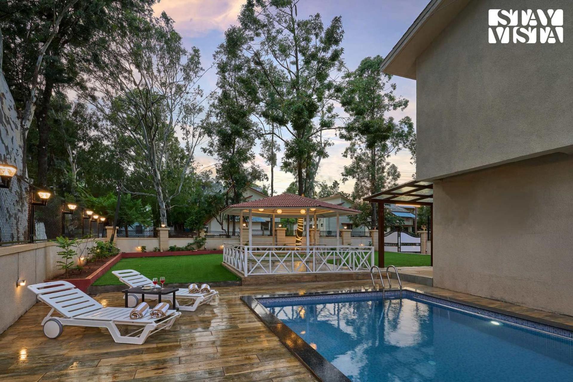Elegant Escapes With Swimming Pool, Lawn & Bonfire At By Stayvista